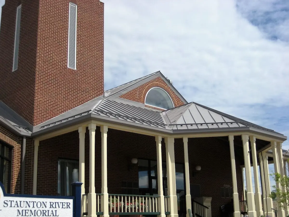 Skilled roofing craftsmen working on a residential roof in Phenix City